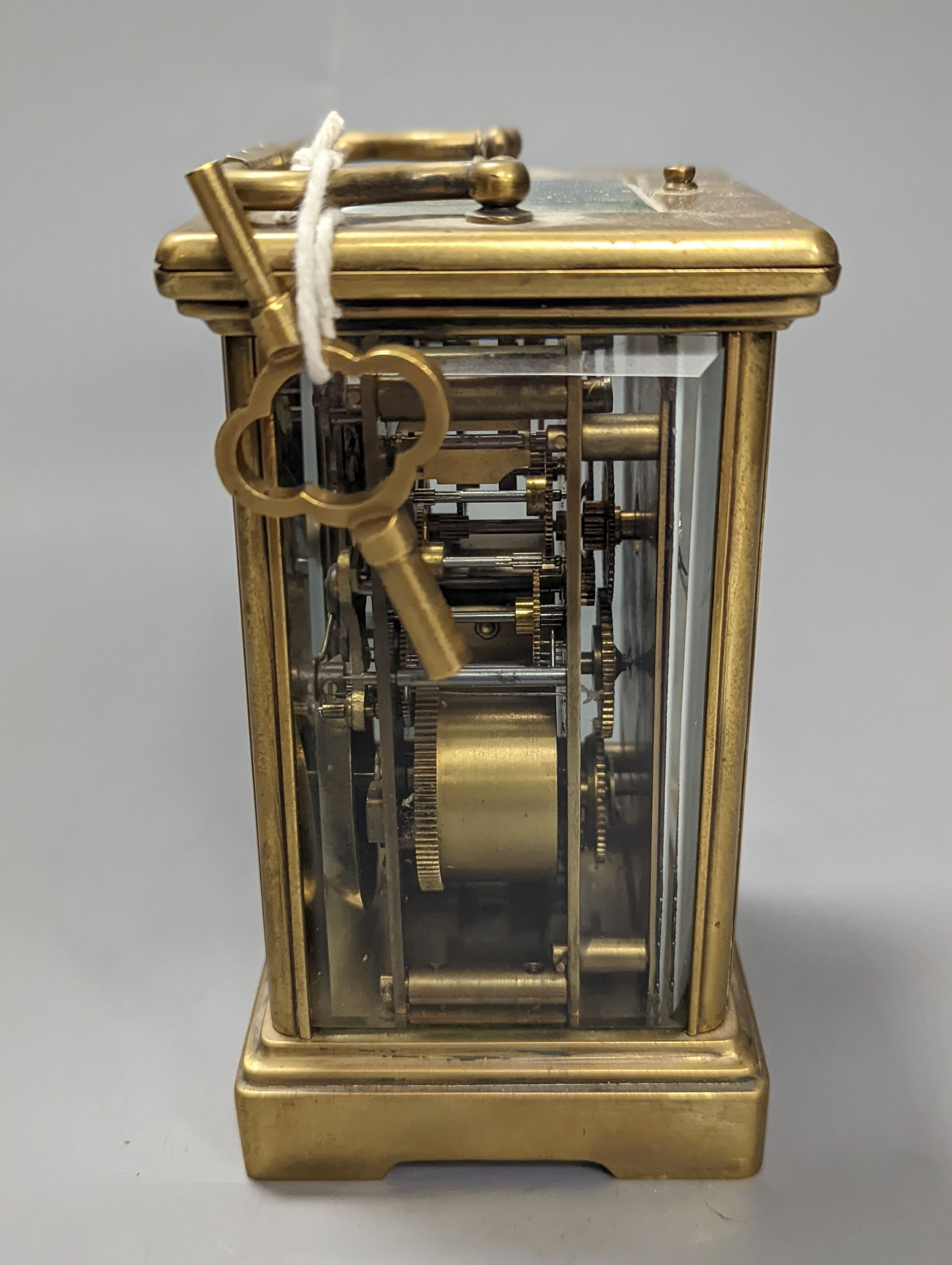 A brass cased carriage clock, with key. 16cm